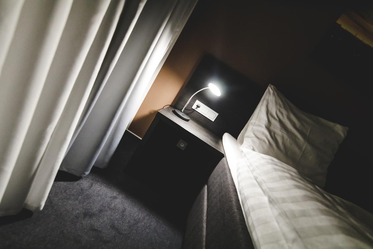 Silesia Residence Ostrava Eksteriør billede A bedside table